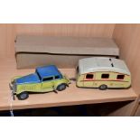 A METTOY TINPLATE CLOCKWORK TWO DOOR SALOON CAR AND METTOY TINPLATE CARAVAN, car has cream body