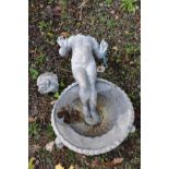 A VINTAGE LEAD BIRD BATH in the form of a child standing on a scalloped footed platter (head