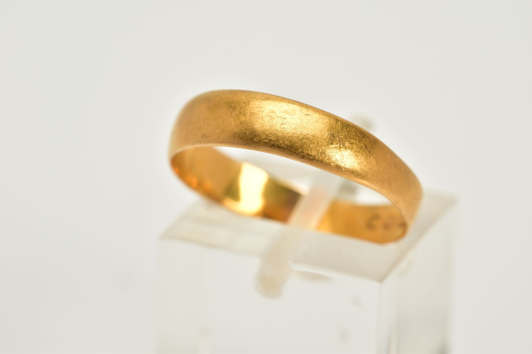 A 22CT GOLD WIDE BAND, the plain polished band, hallmarked 22ct gold Birmingham 1884, ring size P,