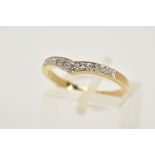 A 9CT GOLD DIAMOND V SHAPE RING, the V shape design set with a row of single cut diamonds, plain