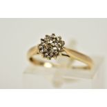 A YELLOW METAL DIAMOND CLUSTER RING, the tiered cluster set with single cut diamond, tapered