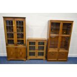 A MODERN OAK CORNER CABINET, together with a matching two door bookcase and a glazed two door