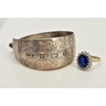 A SILVER BANGLE AND RING, the silver hinged bangle with floral engraved detail, hallmarked