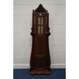 AN EARLY TWENTIETH CENTURY MAHOGANY CORNER CUE CABINET, with a single glazed and fielded panel door,