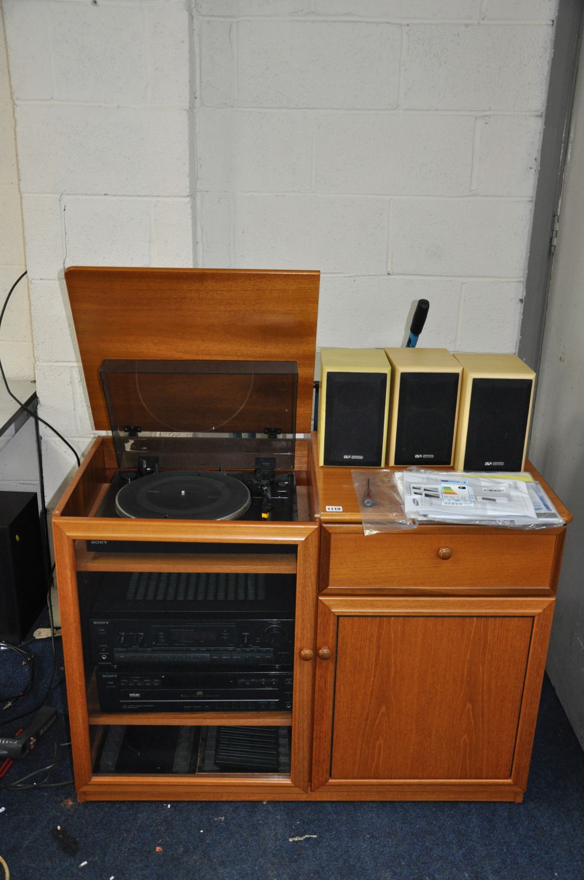 A SONY COMPONANT HI FI in a teak cabinet, including a Sony CDP-C425 5 disc CD player, a STR-D590