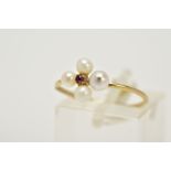 A 9CT GOLD RUBY AND PEARL RING, set with a central circular cut ruby within a four cultured pearl