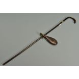 AN ANTIQUE BAMBOO SWORD STICK, in the form of a round handled walking stick, the blade is six