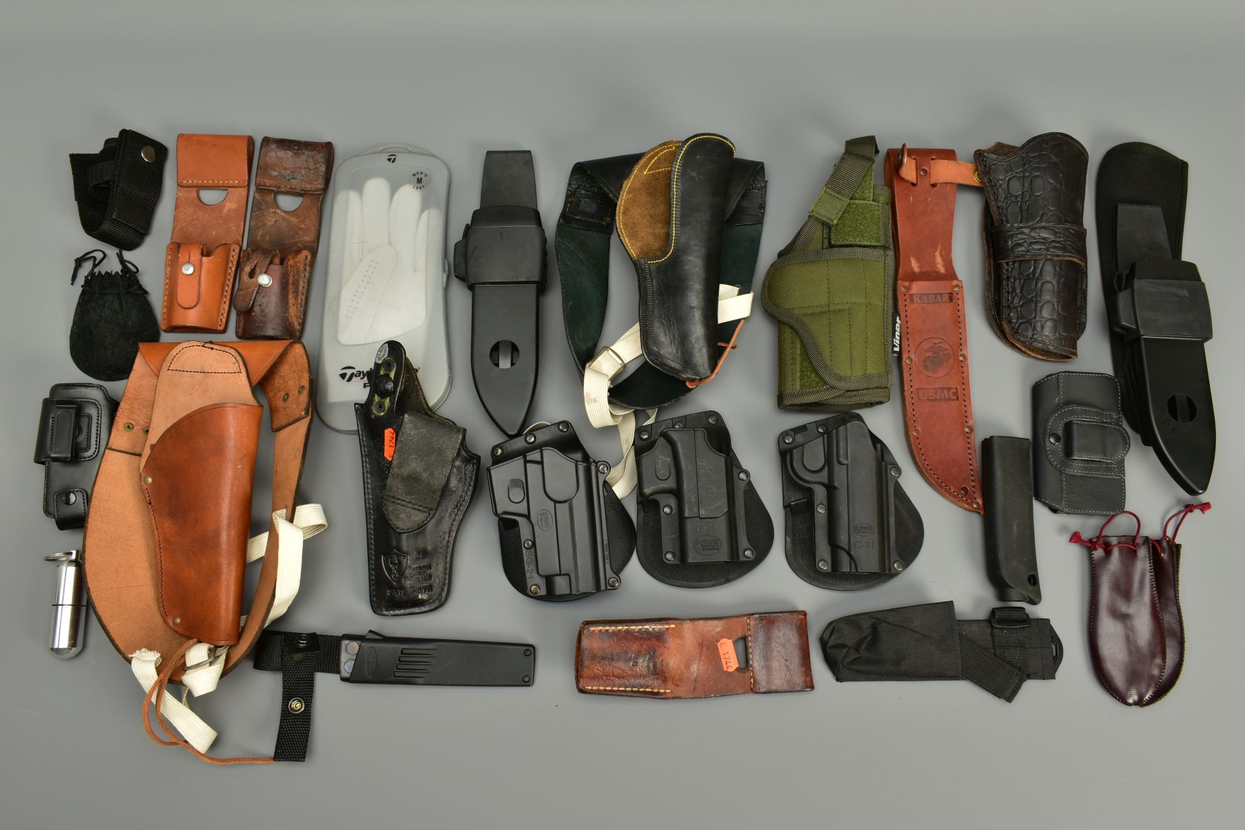 A COLLECTION OF HOLSTERS AND LEATHER ITEMS comprising of two unnamed leather shoulder holsters,