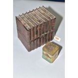 A HUNTLEY & PALMERS BISCUIT TIN IN THE FORM OF A BUNDLE OF BOOKS, TIED WITH A STRAP, together with a