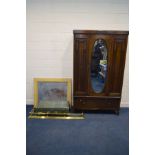 AN EARLY TO MID TWENTIETH CENTURY OAK SINGLE MIRROR DOOR WARDROBE, above a single drawer, a