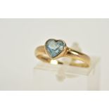 A 9CT GOLD TOPAZ RING, designed with a heart cut blue topaz within a collet mount, plain polished