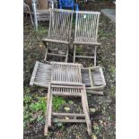 A SET OF FIVE SLATTED HARDWOOD FOLDING GARDEN CHAIRS 51cm wide at the seat
