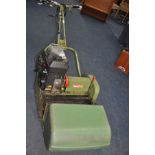 A VINTAGE HAYTER 20 PETROL CYLINDER MOWER with 20 inch cut and grass box (engine pulls freely but