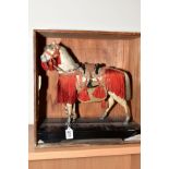 A 20TH CENTURY ORIENTAL MODEL OF A HORSE, composition with pony skin effect, lacquer saddle and