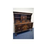 AN EARLY 20TH CENTURY OAK DRESSER, the top section with two open shelves flanking a single