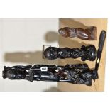 NATIVE ART INTEREST, carved hardwood figure of a woman surrounded by men and women 46cm high, carved