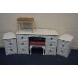 A MODERN WHITE FOUR PIECE BEDROOM SUITE, comprising a dressing table with seven drawers, separate