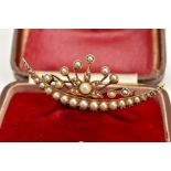 A YELLOW METAL CULTURED PEARL CRESCENT BROOCH, the crescent set with a row of graduated split