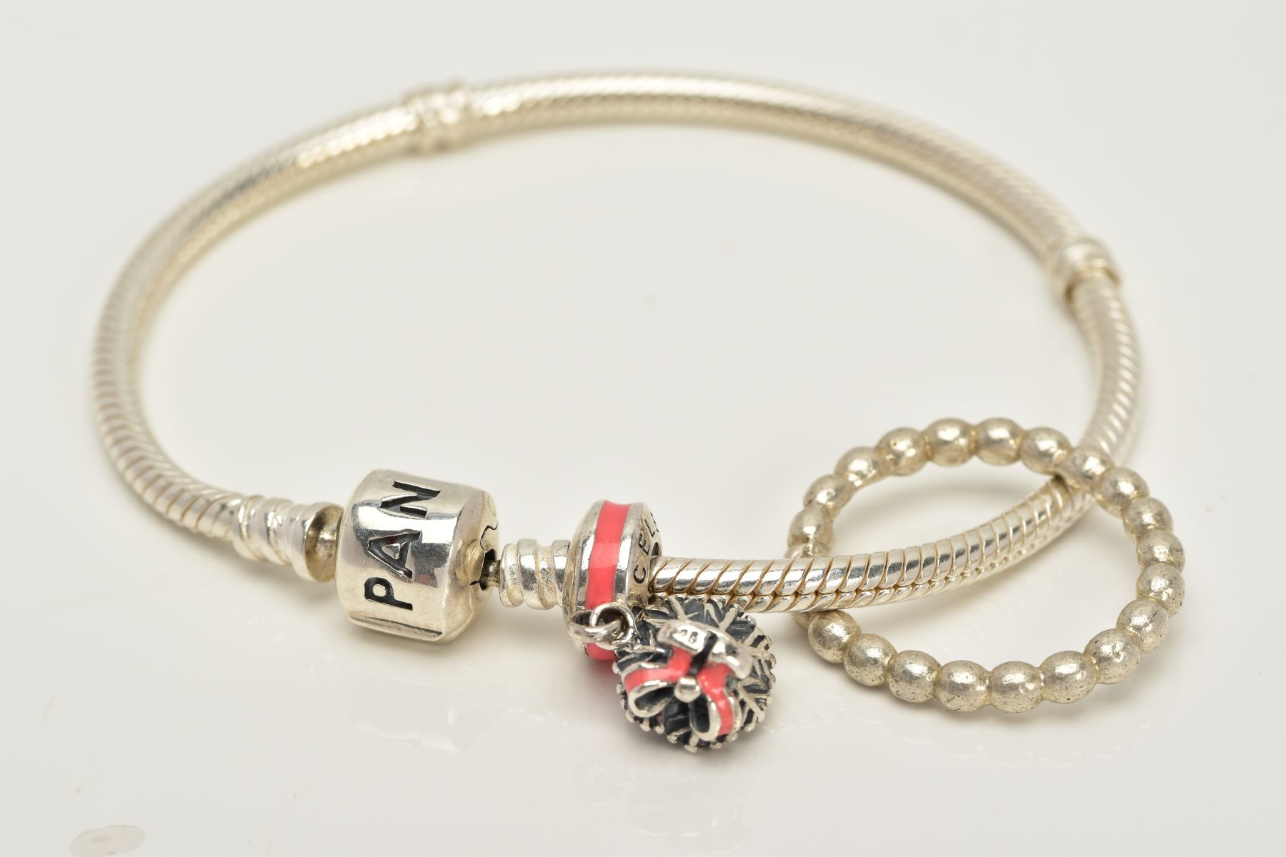 A PANDORA CHARM BRACELET AND WHITE METAL RING, the snake bracelet suspending a bouquet of flowers '