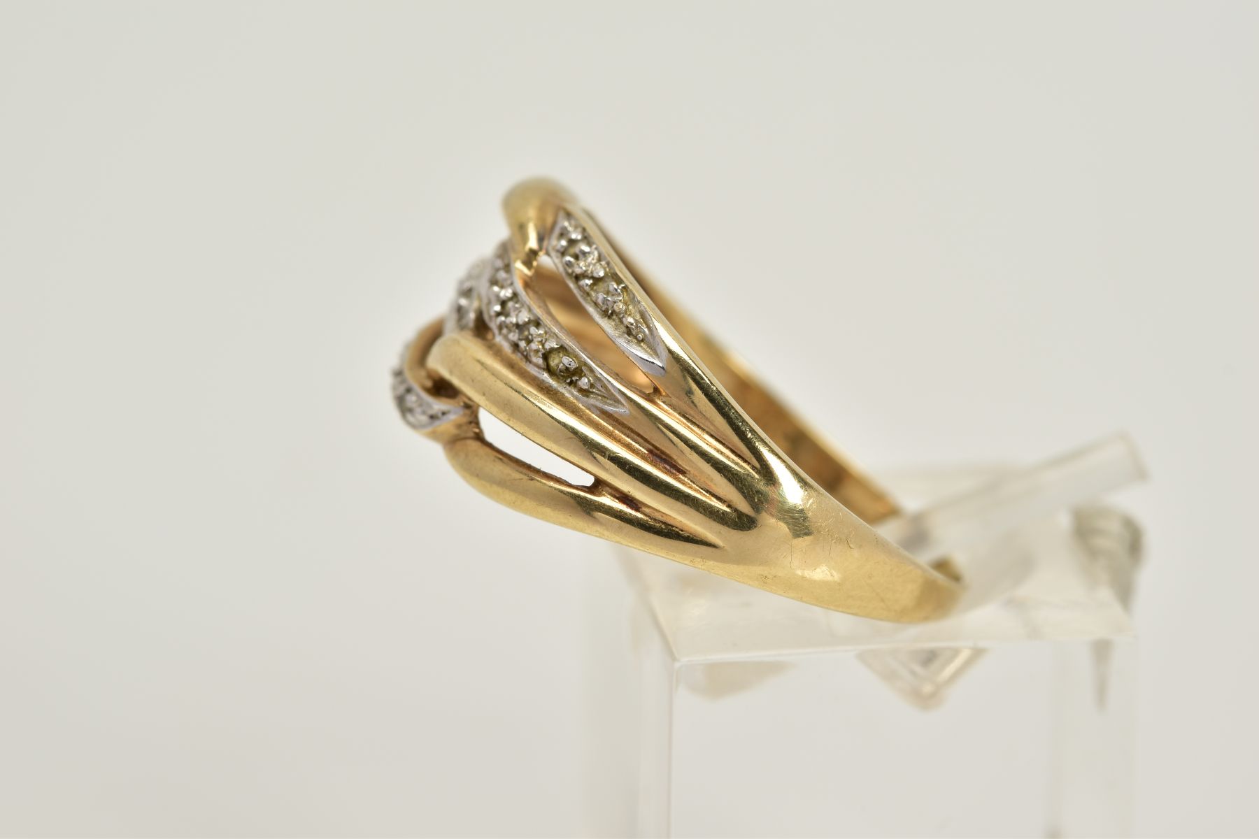 A 9CT GOLD DIAMOND OPENWORK RING, designed with four interlocking openwork hoops, two hoops set with - Image 2 of 3