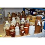 A LARGE COLLECTION OF EARTHENWARE JARS AND POTS, apothecary type pots, ink well type pots etc, no