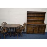 AN OAK DROP LEAF TABLE, four wheel back chairs (sd) together with an oak dresser with three drawers,
