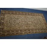 A KAYSERI FINE WOOL RUG, of a russet, cream and black ground, 292cm x 148cm (sd and worn fraying