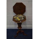 A VICTORIAN WALNUT TRUMPET WORK TABLE with integral assorted compartments supported on shaped tripod