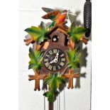A MID TWENTIETH CENTURY CUCKOO CLOCK, with pendulum and weights height approximately 27cm