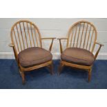 A PAIR OF ERCOL WINDOR MODEL 334E BEECH EAST ARMCHAIRS, the hoop back with spindles, spring seat and