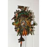 A MID TWENTIETH CENTURY cuckoo clock with pendulum and weights, height approximately 33cm