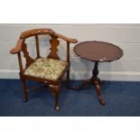 A REPRODUCTION MAHOGANY CORNER CHAIR, with a splat back and floral upholstered drop in seat pad