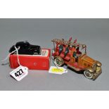 A TINPLATE CLOCKWORK FIRE ENGINE, faded brown bonnet and cab, red chassis and body, movable