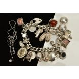 A SILVER CHARM BRACELET AND CHAIN, the charm bracelet suspending twenty six charms such as a church,