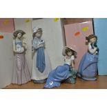 FOUR NAO FIGURES, 'Girl with Puppy' No. 0241 (boxed), 'Pampered Poodle' No. 1157 (boxed) 'Girl