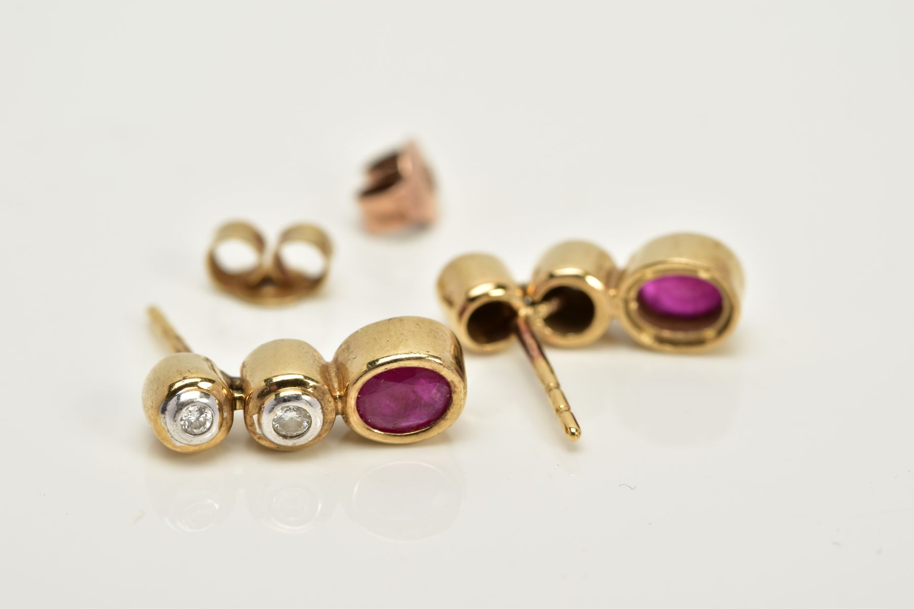 A PAIR OF 9CT GOLD DIAMOND AND RUBY DROP EARRINGS, each designed with two round brilliant cut - Image 2 of 2