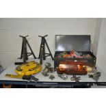 A PAIR OF VINTAGE AXLE STANDS, a tin trunk containing vintage vehicle spares including Universal