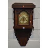 A LATE 19TH CENTURY MAHOGANY AND CROSSBANDED WALL CLOCK, brassed and enamelled 5 1/2' dial,