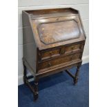 A MID TO LATE 20TH CENTURY OAK BUREAU, with two short over one long drawer, width 67cm x depth