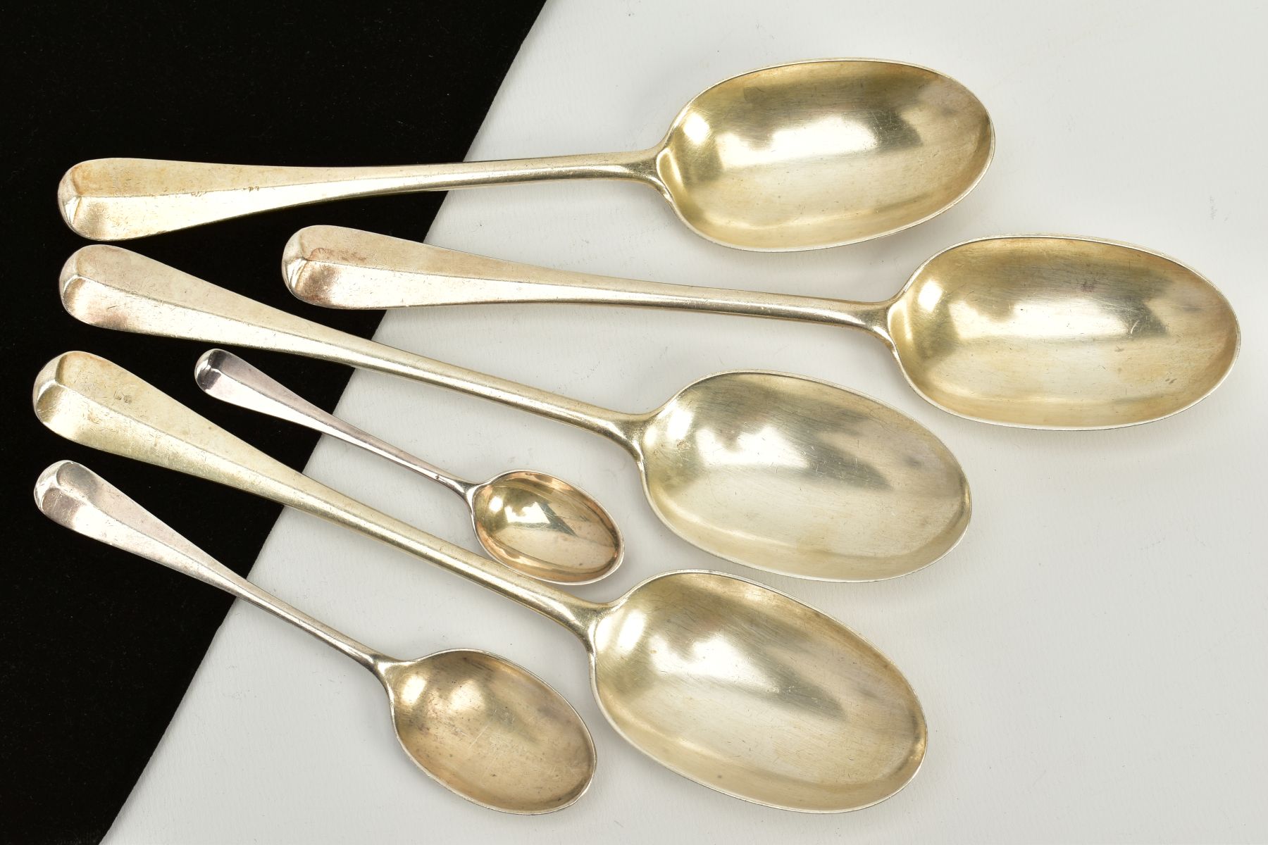 A SELECTION OF SILVER RAT TAIL SPOONS, to include four tablespoons, hallmarked London 1922, a