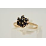 A 9CT GOLD SAPPHIRE CLUSTER RING, the tiered cluster set with circular cut blue sapphires, tapered