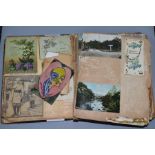 AN EARLY 20TH CENTURY SCRAPBOOK, containing postcards, greetings cards and newspaper cuttings