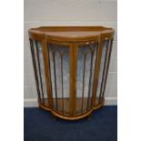 A 1930'S WANUT GLAZED SINGLE DOOR CHINA CABINET on ball and claw feet, width 102cm x depth 42cm x