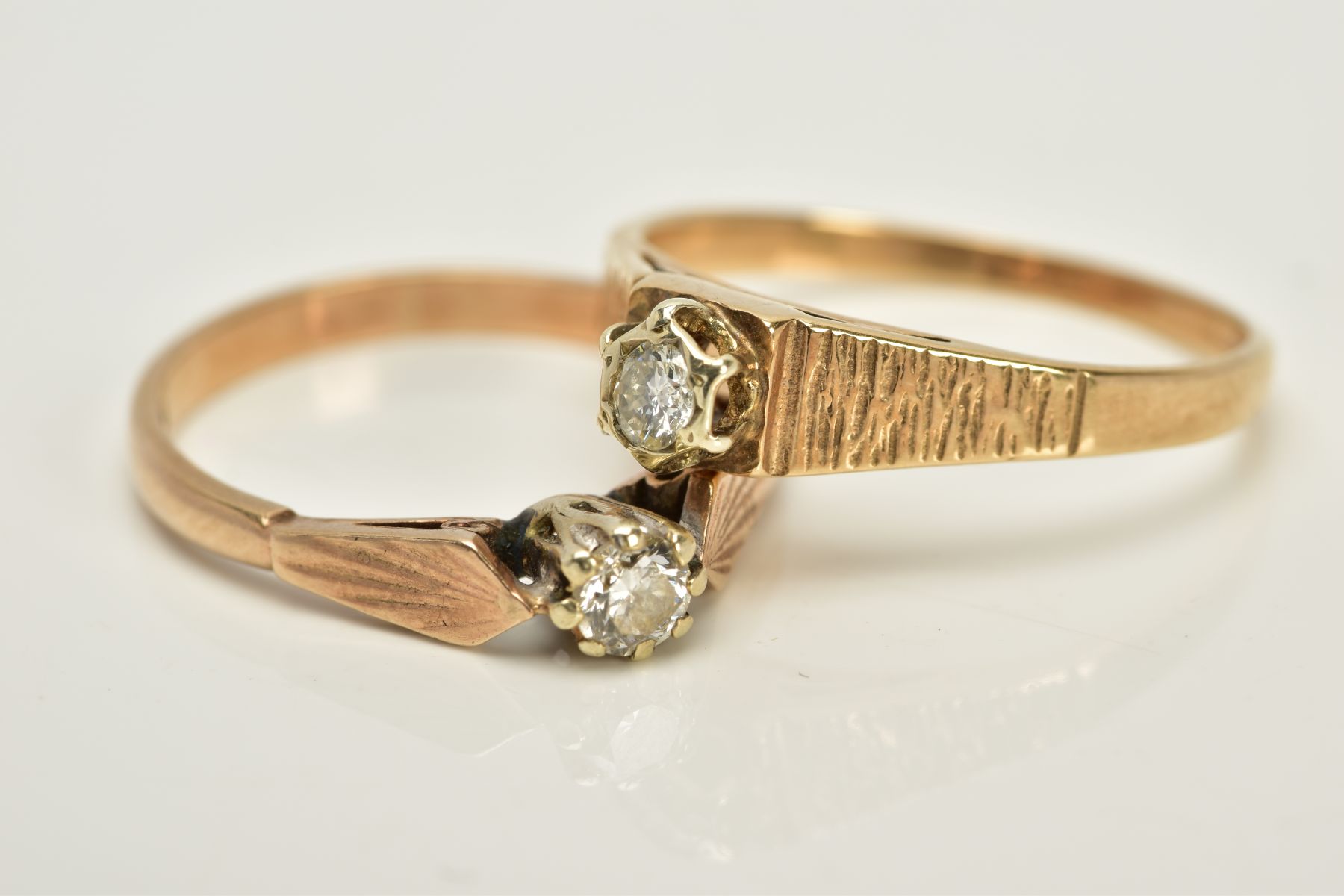 TWO 9CT GOLD SINGLE STONE DIAMOND RINGS, the first designed with a raised claw set round brilliant - Bild 2 aus 3