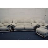 A CREAM UPHOLSTERED FOUR PIECE LOUNGE SUITE, comprising a two seater settee, pair of armchairs and a