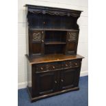 A MID TO LATE 20TH CENTURY OAK DRESSER with dental moulding and pierced apron under a fixed cornice,
