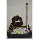 A TRAY CONTAINING A QUANTITY OF GOLF BALLS and twoTop Flite caps