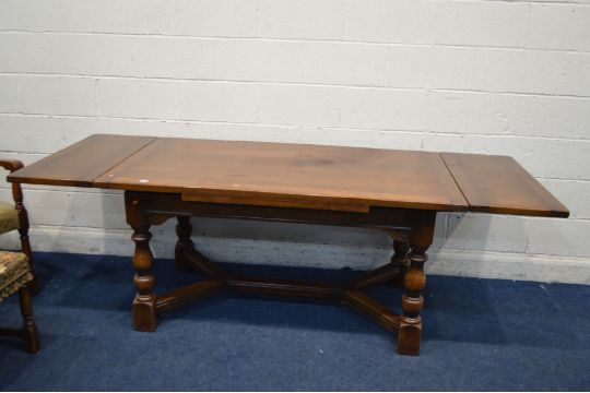 A REPRODUCTION OAK DRAW LEAF DINING TABLE, on block and turned legs, united by a cross stretcher, - Image 2 of 2