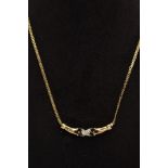 A 9CT GOLD SAPPHIRE AND DIAMOND PENDANT NECKLACE, the fixed pendant panel designed with a central
