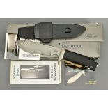 A WILKINSON SWORD CSK 185 DARTMOOR SURVIVAL KNIFE in its original packaging complete with sheath,